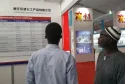 French assistant introducing products at the 2016 exhibition