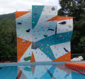 Swimming pool rock climbing wall